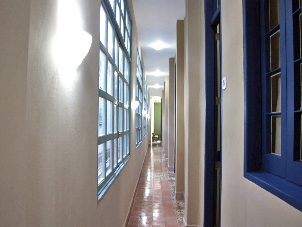 The brightly lit corridor at La Gargola Guesthouse in Old Havana, Cuba