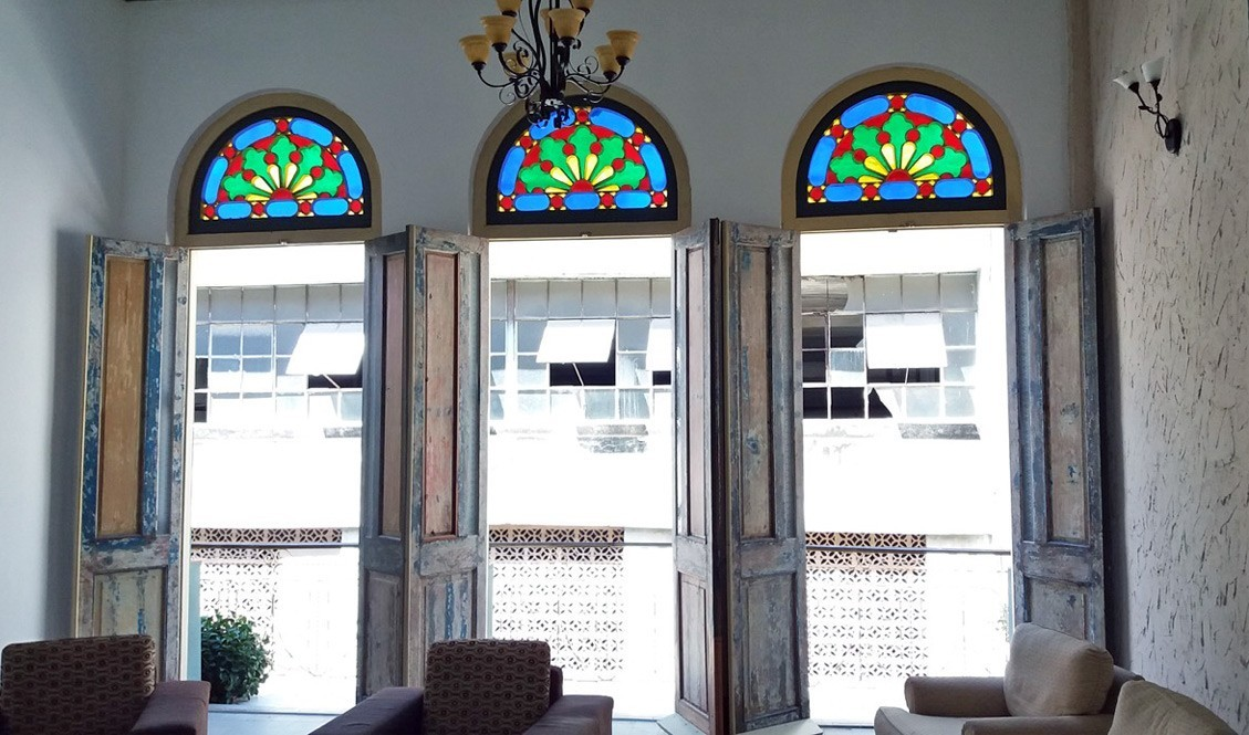 Large doorways with stained glass arches in Old Havana, Cuba