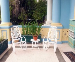 Classic Cuban rocking chairs on a porch in Havana