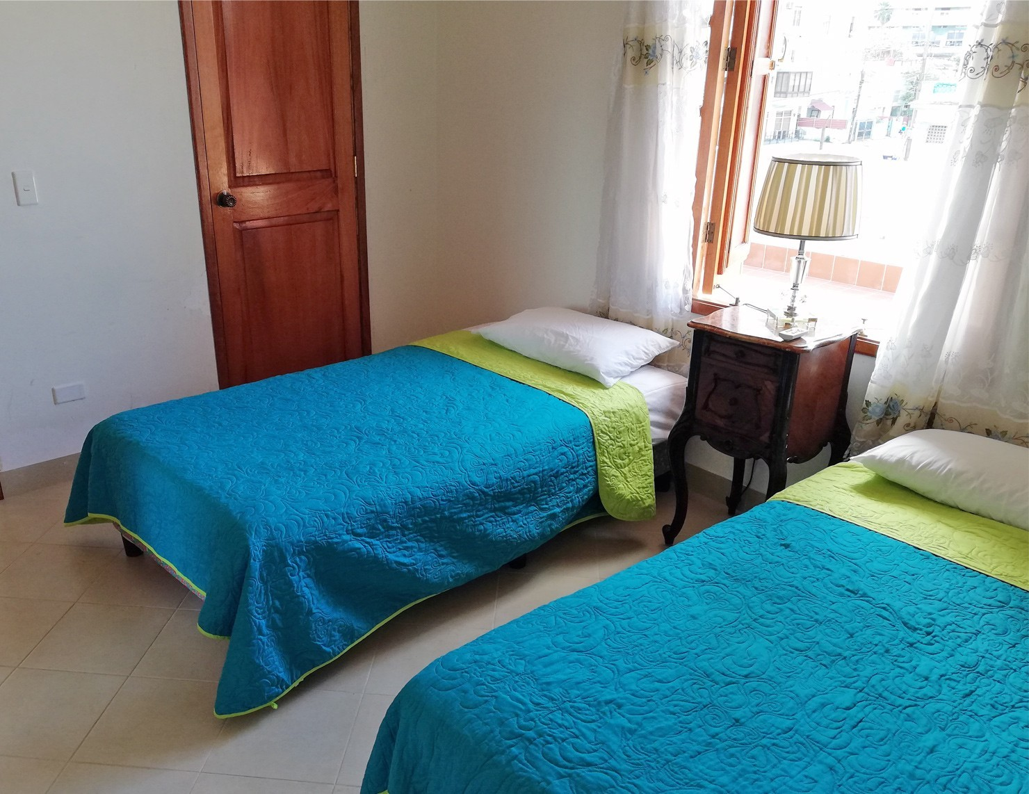 A clean modern guesthouse room in Havana